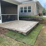Raised Paver Patio Against House